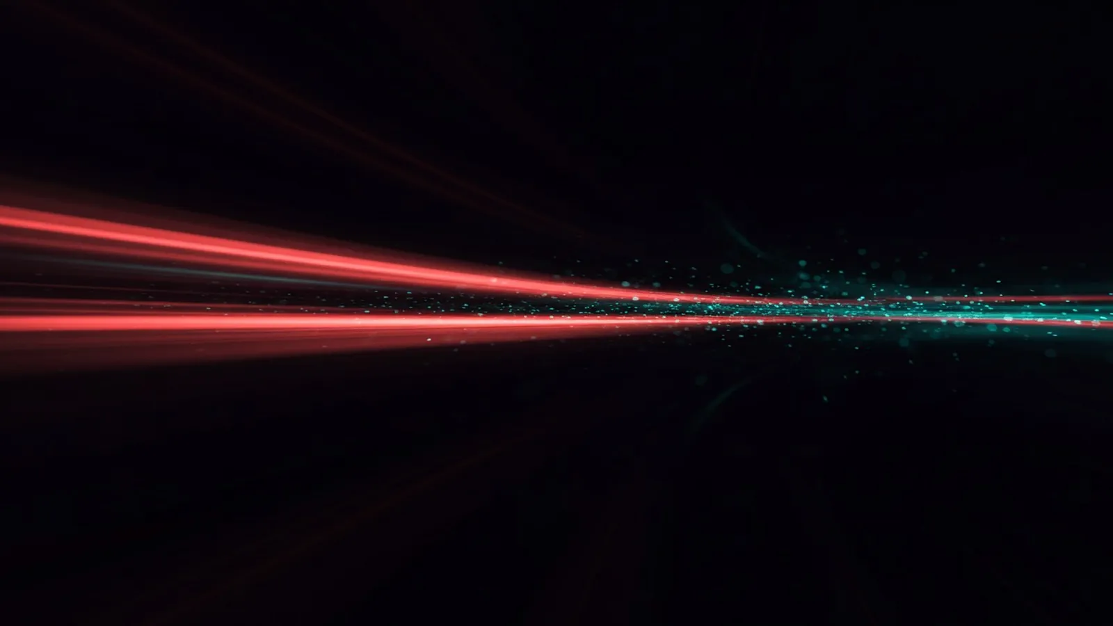 Coral and teal light trails racing across a dark background.